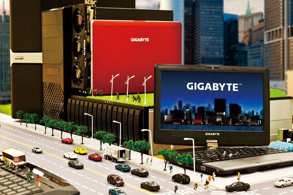 Werbung für ein Gigabyte-Notebook in Miniatur mit Maschinen und Menschen