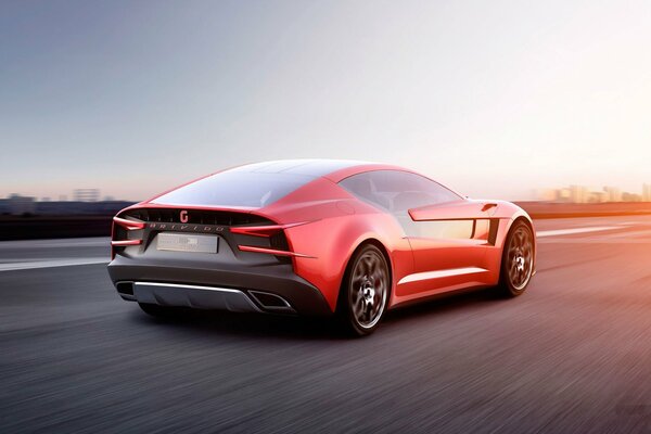 Rotes Superauto mit Geschwindigkeit unterwegs