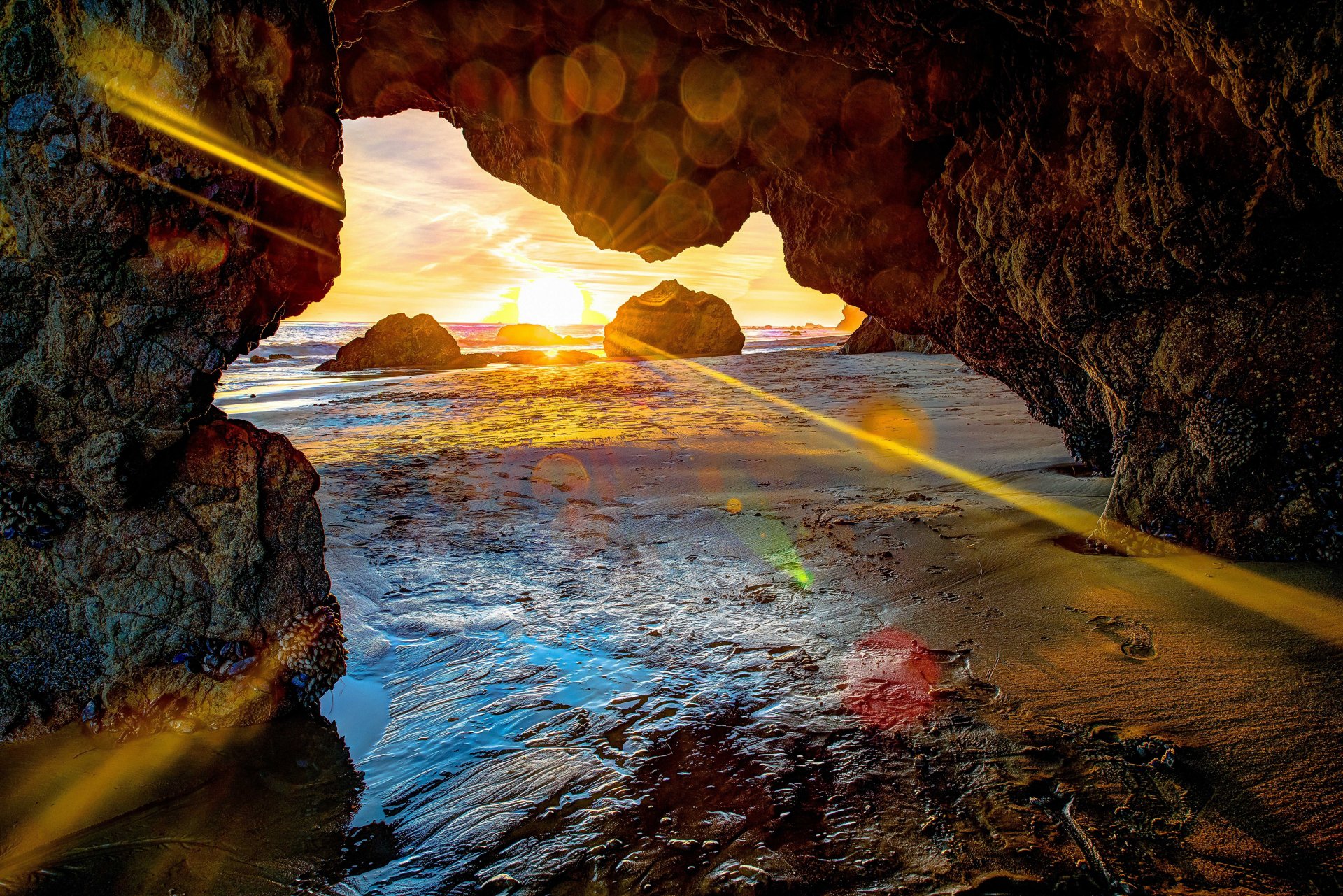 meer küste felsen sonnenuntergang landschaft grotte höhle strahlen sonne steine blendung