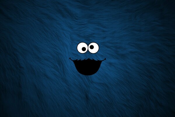 Niedliche blaue Monster auf einem zotteligen Hintergrund