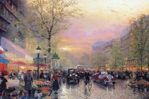 Abendlicher Boulevard in Frankreich mit Laternen und Autos