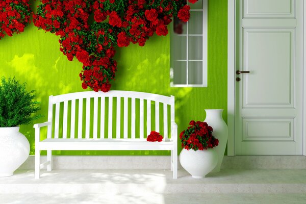 Eine Bank an einer mit Blumen geschmückten grünen Wand